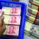 Yuan Surpasses Dollar in China's Cross-Border Transactions